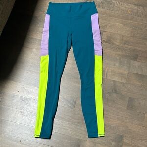 Fabletics powerhold Colorblock Leggings with Teal, Purple, and Neon Yellow
